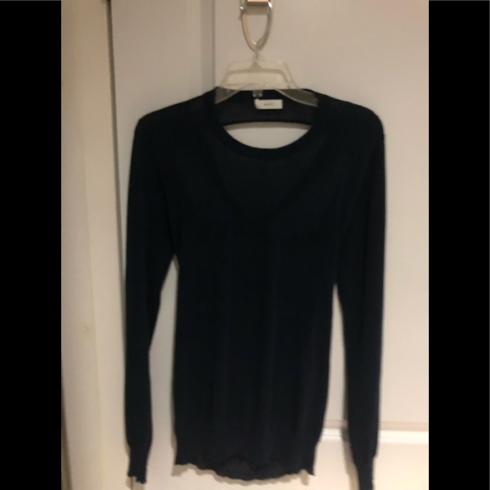 Long sleeve dark blue sweater.